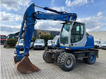 Wheel excavator NEW HOLLAND MH CITY