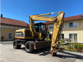 Wheel excavator Caterpillar M 312: picture 3