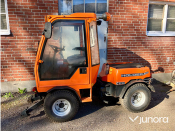 Municipal tractor HOLDER