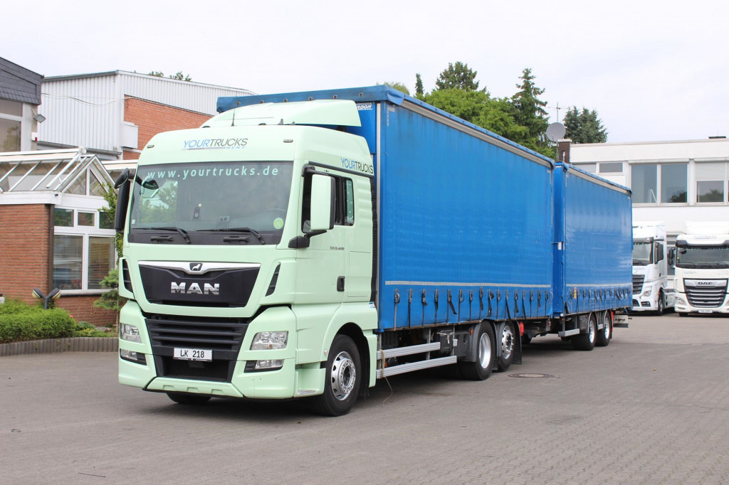 MAN TGX 26.460 Retarder Jumbo-Zug 120M3 Durchlade - Curtainsider truck: picture 1 MAN TGX 26.460 Retarder Jumbo-Zug 120M3 Durchlade - Curtainsider truck: picture 1