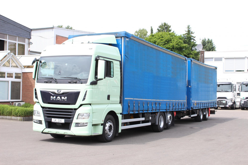 MAN TGX 26.460 Retarder Jumbo-Zug 120M3 Durchlade - Curtainsider truck: picture 1 MAN TGX 26.460 Retarder Jumbo-Zug 120M3 Durchlade - Curtainsider truck: picture 1