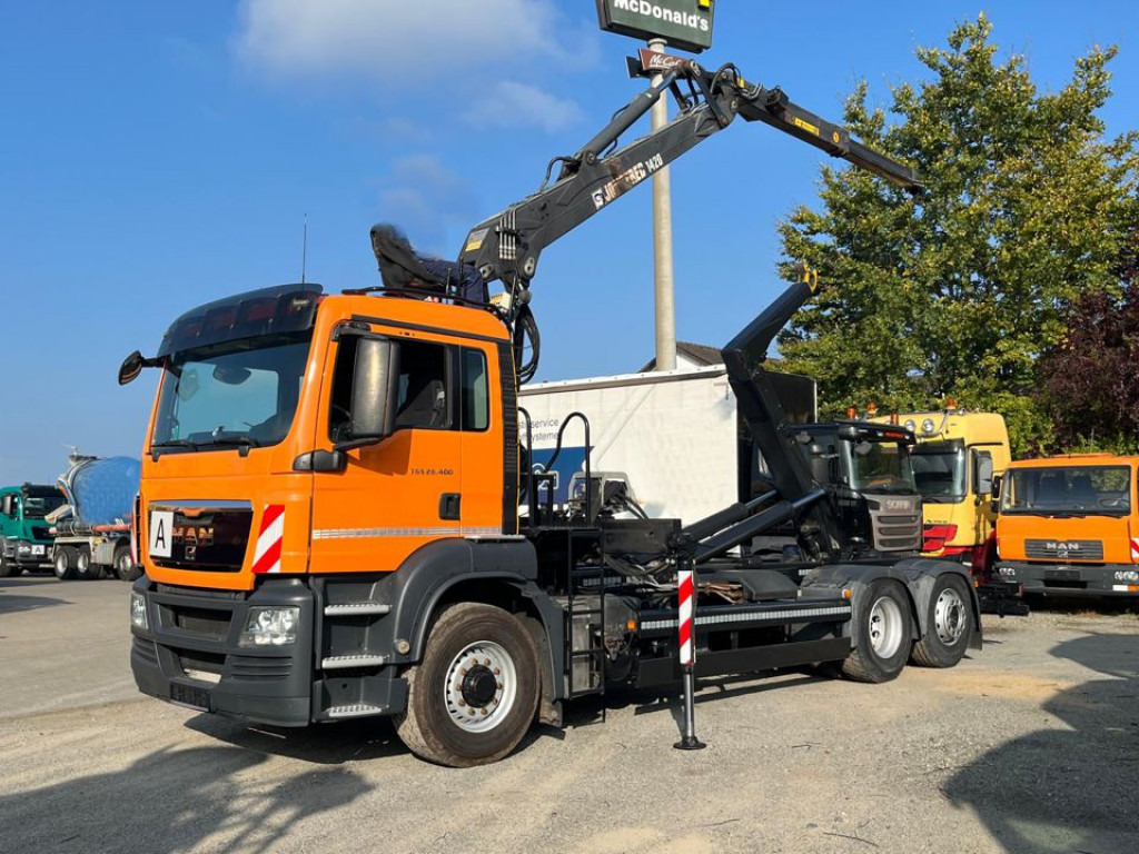 MAN TG-S 26.400 6x4H-2 BL Abrollkipper mit Kran Lift Lenk - Hook lift truck, Crane truck: picture 1 MAN TG-S 26.400 6x4H-2 BL Abrollkipper mit Kran Lift Lenk - Hook lift truck, Crane truck: picture 1