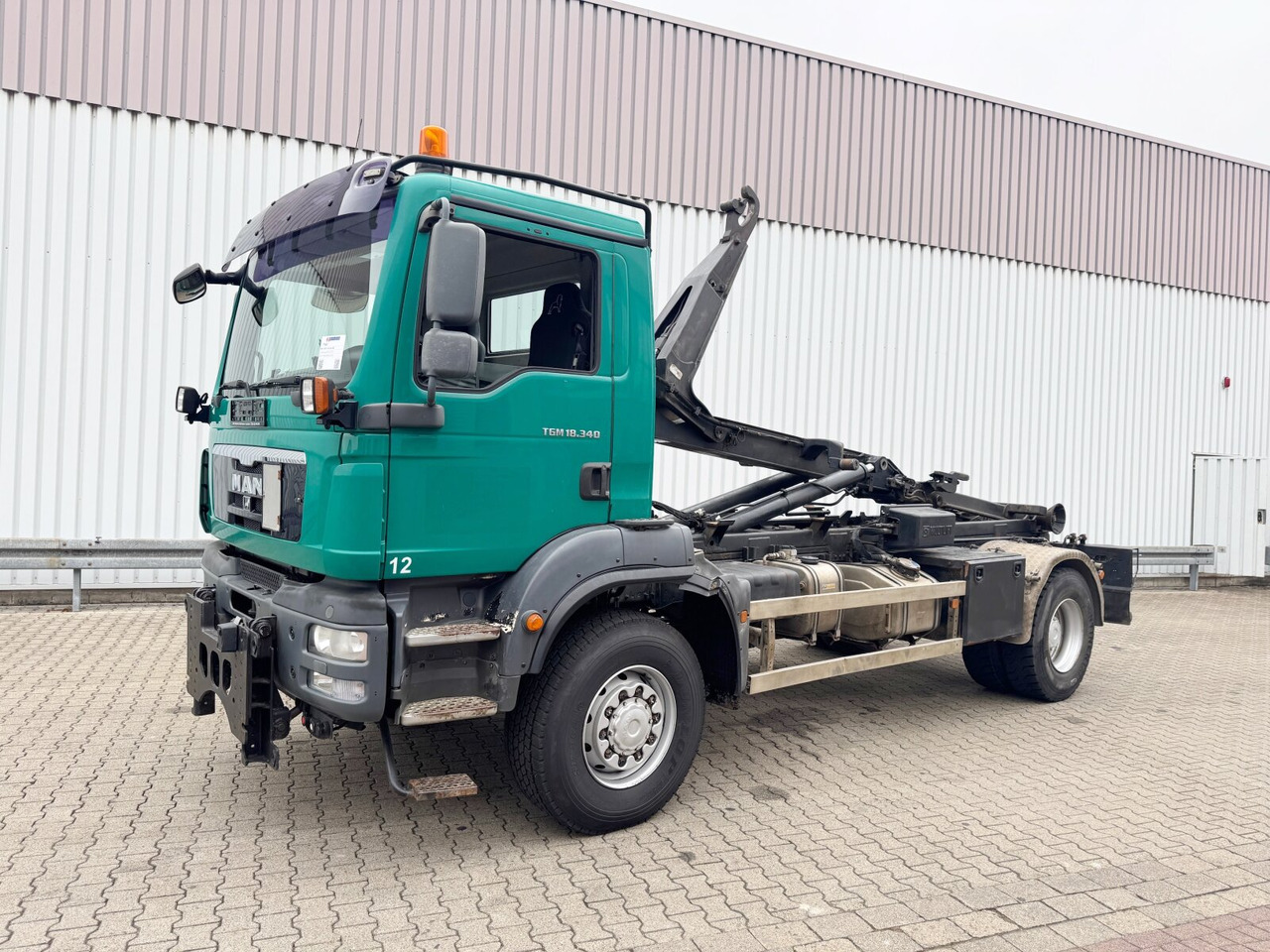MAN TGM 18.340 4x4 BB TGM 18.340 4x4 BB, Hiab LHT 19046 Abrollkipper, Widi Platte - Hook lift truck: picture 1 MAN TGM 18.340 4x4 BB TGM 18.340 4x4 BB, Hiab LHT 19046 Abrollkipper, Widi Platte - Hook lift truck: picture 1
