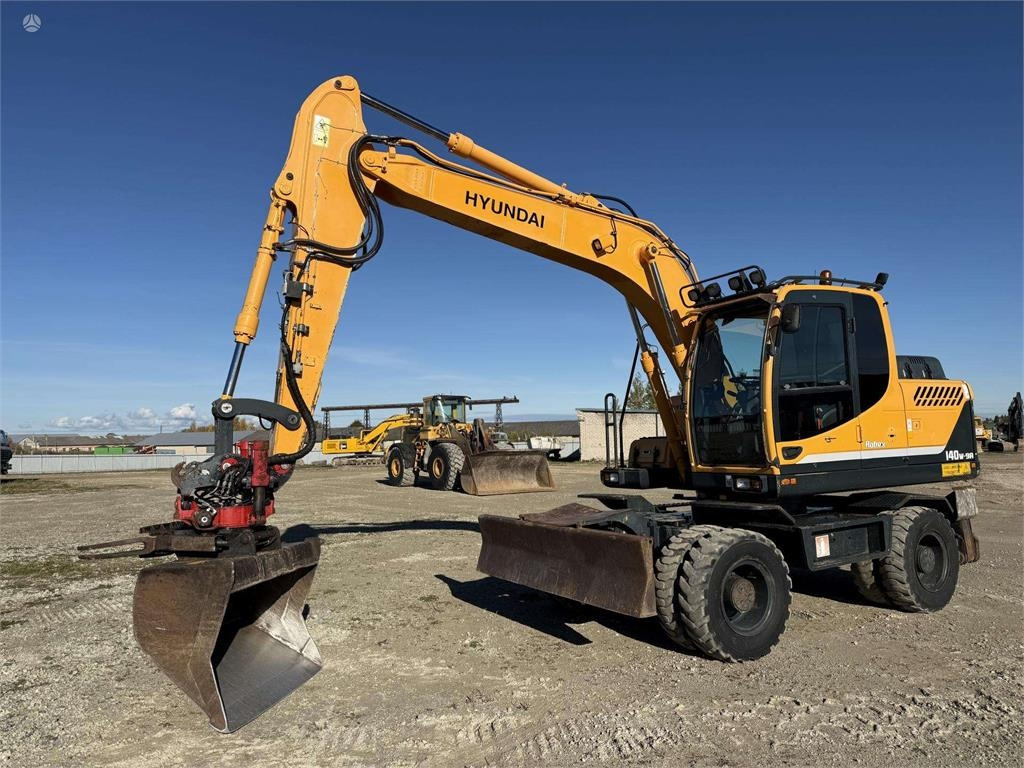Hyundai Robex 140 W-9A Rototilt + grap - Wheel excavator: picture 1 Hyundai Robex 140 W-9A Rototilt + grap - Wheel excavator: picture 1