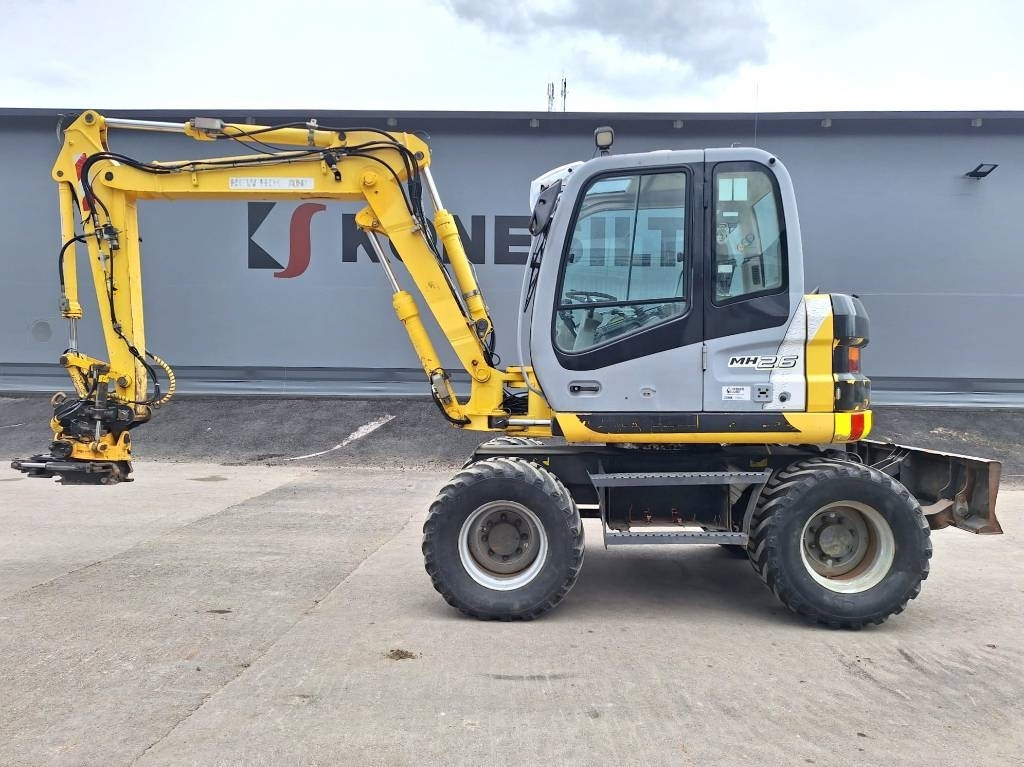 New Holland MH2.6 ENGCON PIHDEILLÄ - Wheel excavator: picture 1 New Holland MH2.6 ENGCON PIHDEILLÄ - Wheel excavator: picture 1