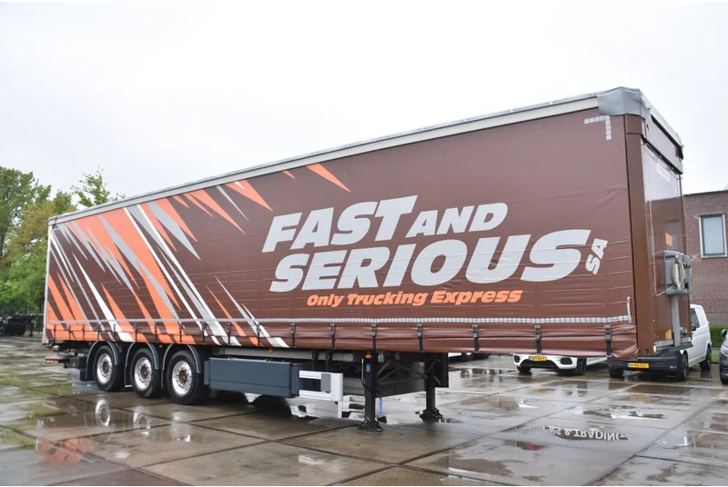 Fruehauf SLIDING CURTAINS/ROOF - TOPLIFT SYSTEM - LIFT AXLE - STEERING AXLE - SAF AXLES - ALCOA'S - DHOLLANDIA - TOP CONDITION - - Curtainsider semi-trailer: picture 1 Fruehauf SLIDING CURTAINS/ROOF - TOPLIFT SYSTEM - LIFT AXLE - STEERING AXLE - SAF AXLES - ALCOA'S - DHOLLANDIA - TOP CONDITION - - Curtainsider semi-trailer: picture 1