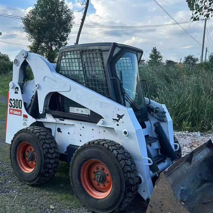 Used Bob Cat Bob Cat S300 Used Mini Skid Steer Wheel Loader Multifunctional Track Loaders Bobcat S300 - Wheel loader: picture 1 Used Bob Cat Bob Cat S300 Used Mini Skid Steer Wheel Loader Multifunctional Track Loaders Bobcat S300 - Wheel loader: picture 1
