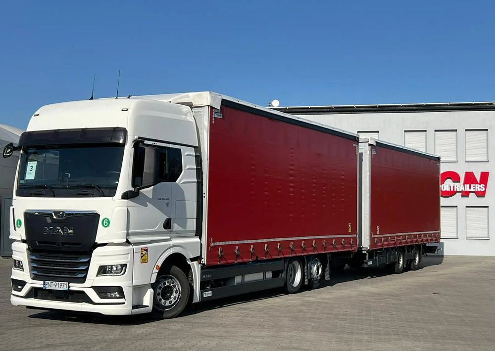 MAN TGX 26.470 z przyczepą Redos - Curtainsider truck: picture 1 MAN TGX 26.470 z przyczepą Redos - Curtainsider truck: picture 1