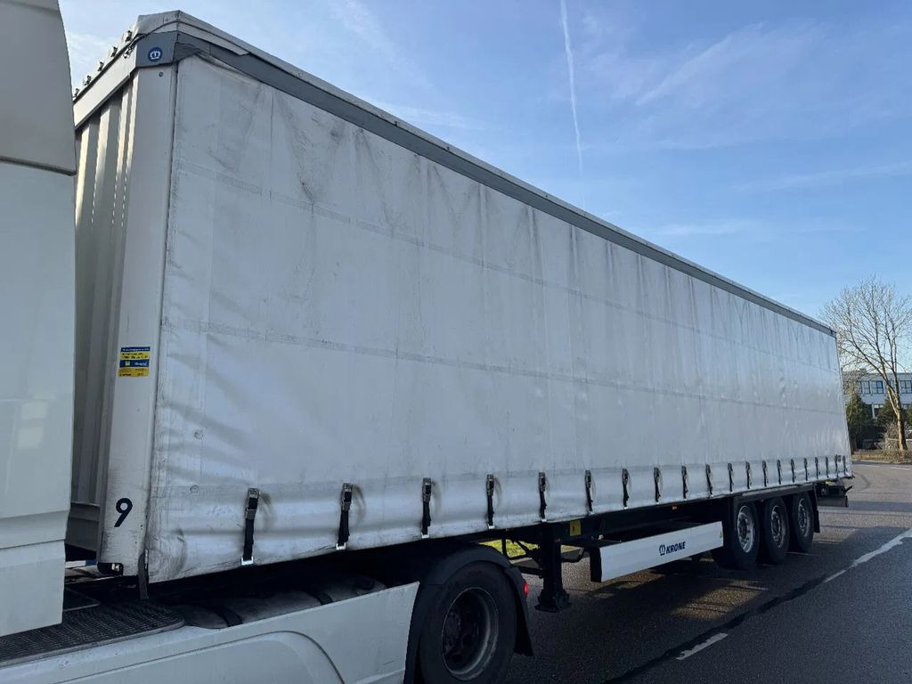 Krone SD - 3 AXLE SAF + SLIDING ROOF + LIFT AXLE - Curtainsider semi-trailer: picture 1 Krone SD - 3 AXLE SAF + SLIDING ROOF + LIFT AXLE - Curtainsider semi-trailer: picture 1