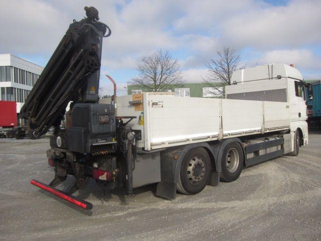 MAN TGX 26.440 mit Hiab-Kran Funkfernbedienung - Dropside/ Flatbed truck, Crane truck: picture 4 MAN TGX 26.440 mit Hiab-Kran Funkfernbedienung - Dropside/ Flatbed truck, Crane truck: picture 4