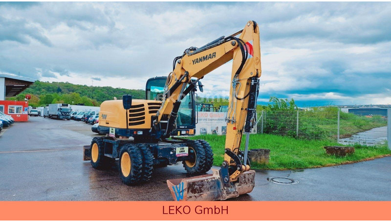 Yanmar B 95W Mit Drei Löffeln und Ein Hammer - Wheel excavator: picture 1 Yanmar B 95W Mit Drei Löffeln und Ein Hammer - Wheel excavator: picture 1